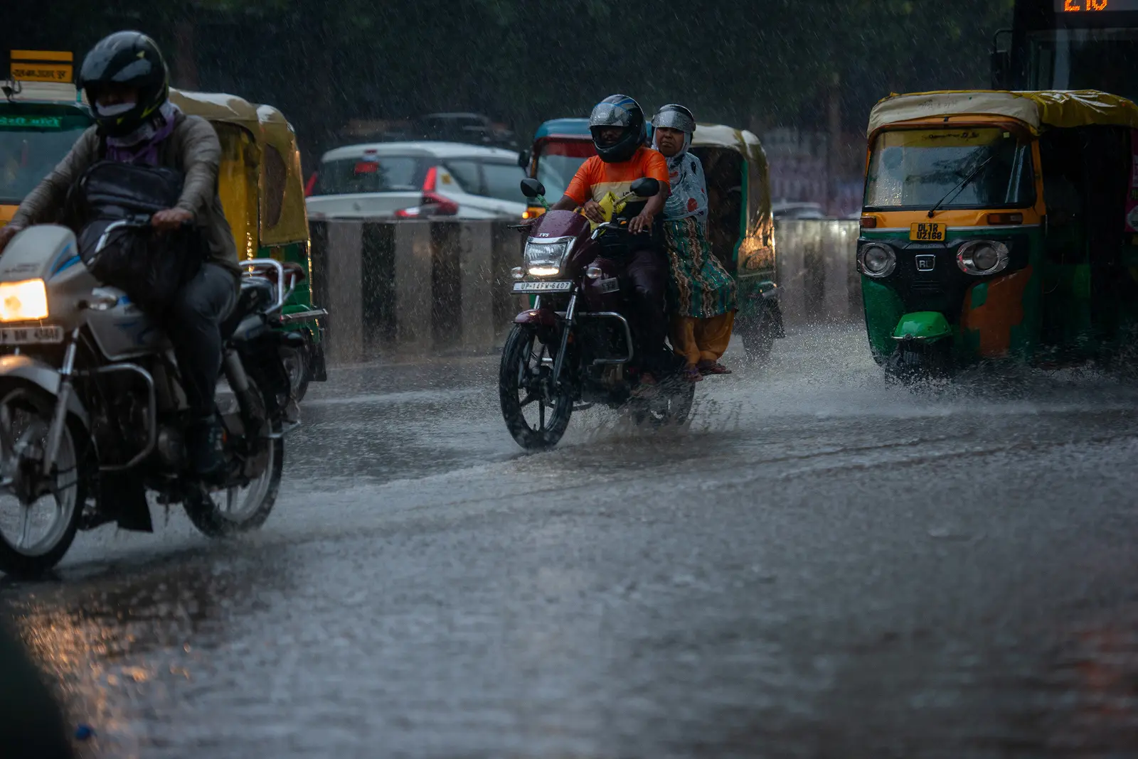 Road of Delhi on heavy rain day with bikes and other vehicles